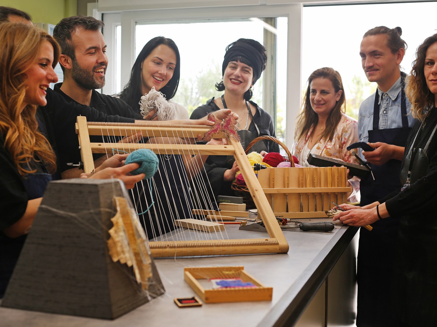 Ioanna Lalaounis et al. standing around a table