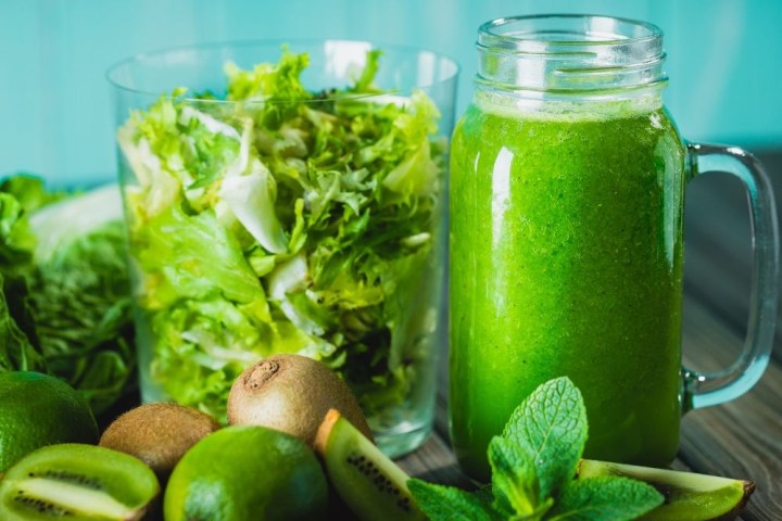 a green apple on a table