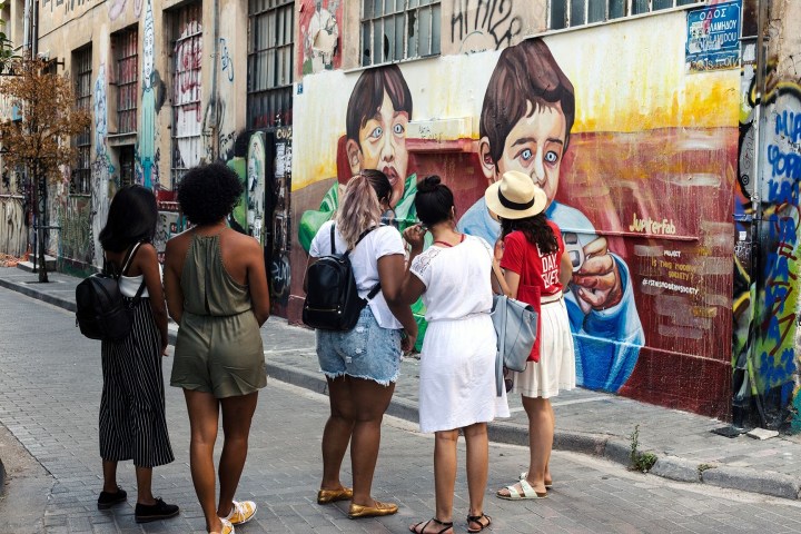 a group of people walking down the street