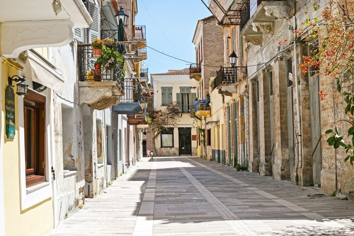 a street scene with focus on the sidewalk