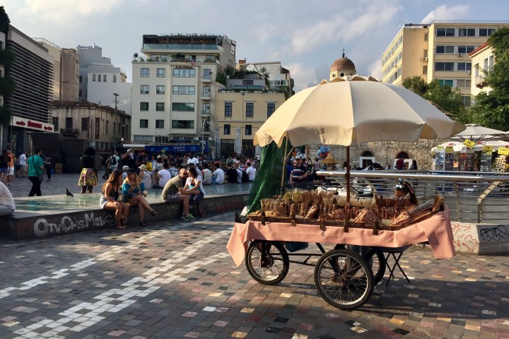 a group of people riding on the back of a horse drawn carriage