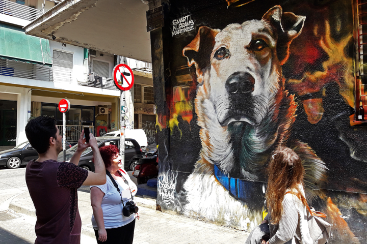 a group of people standing next to a dog