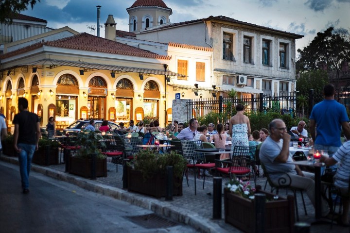 a group of people walking in front of a building