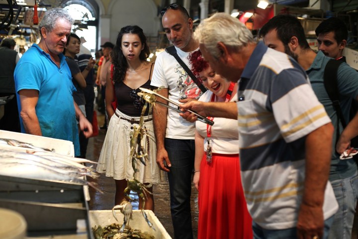 Irene Tsitirides et al. standing in front of a crowd