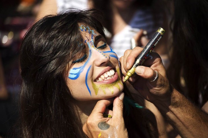 a close up of a woman with her mouth open